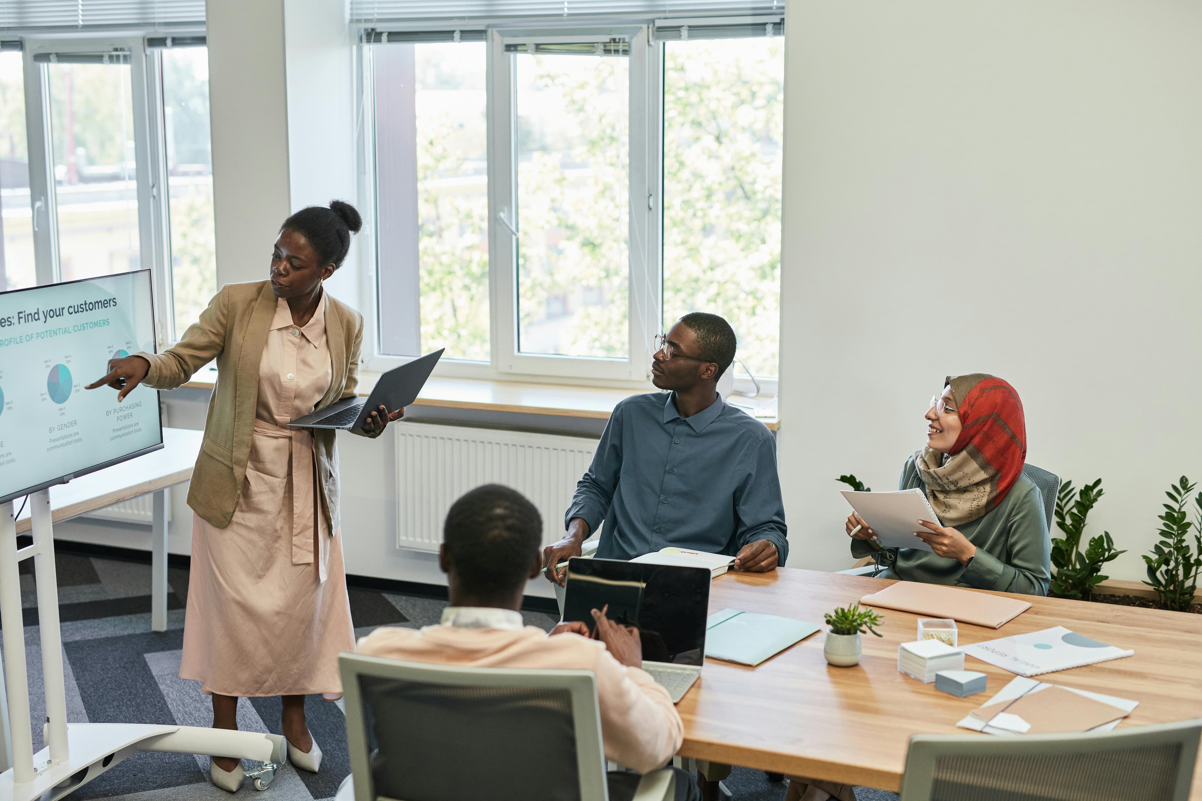Team reviewing a business presentation in a professional setting