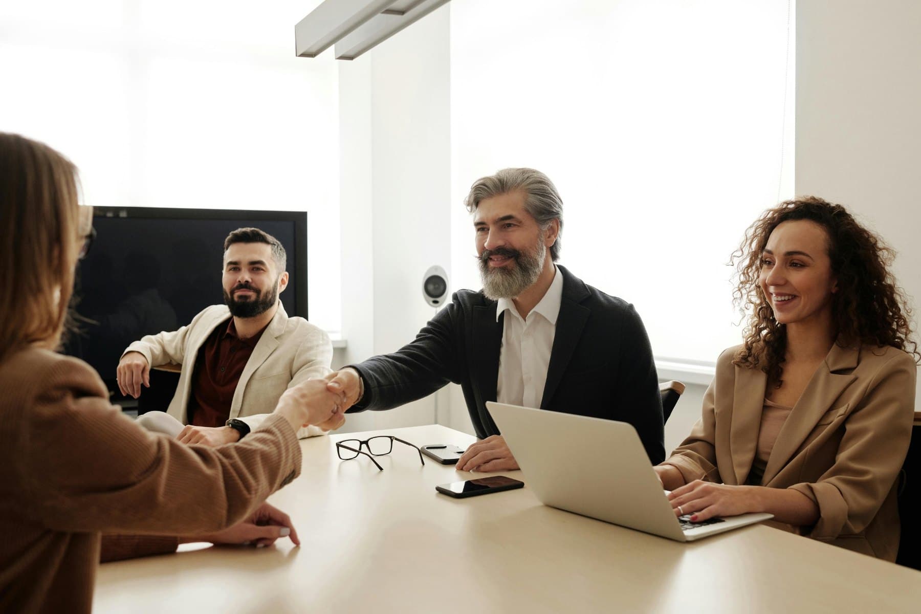 Business meeting handshake representing consultation and partnership