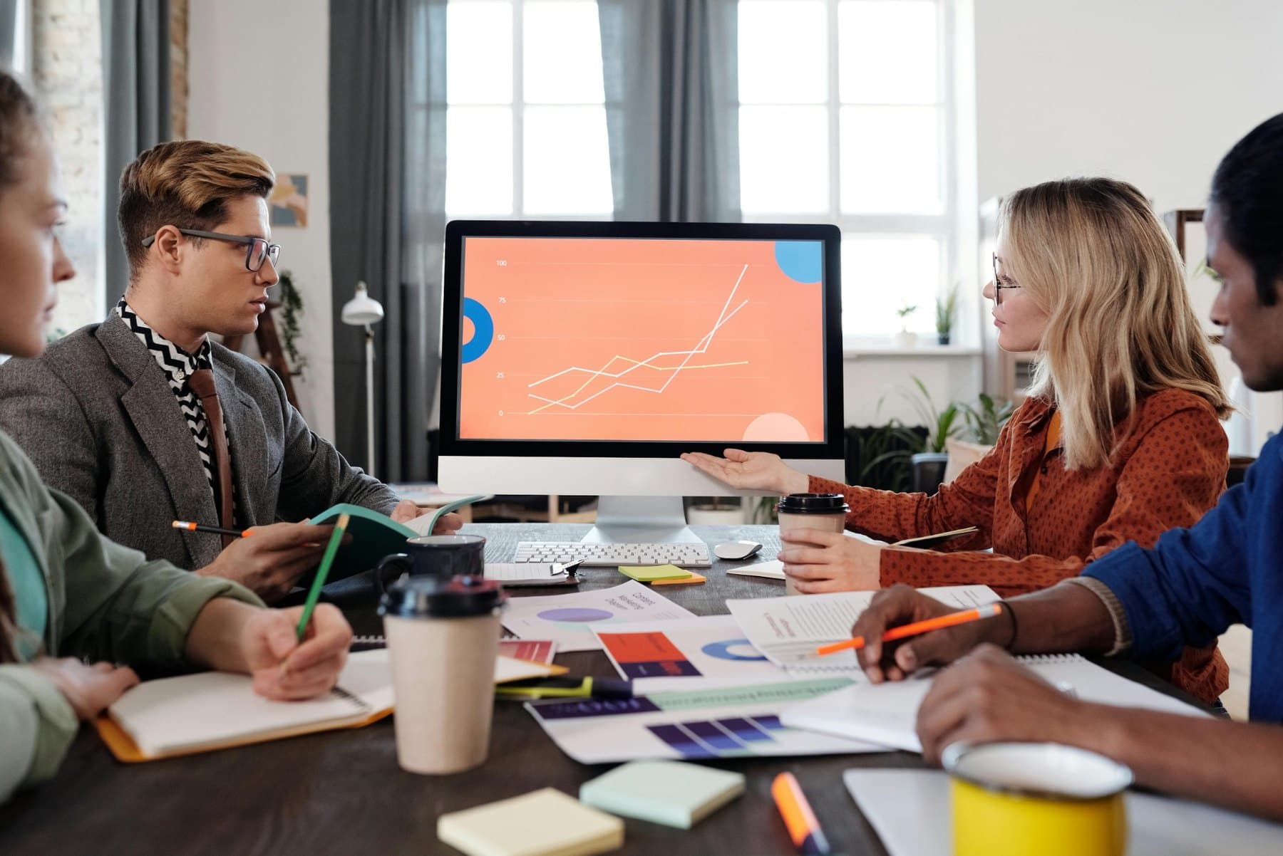 Business team reviewing AI and data visualization concepts