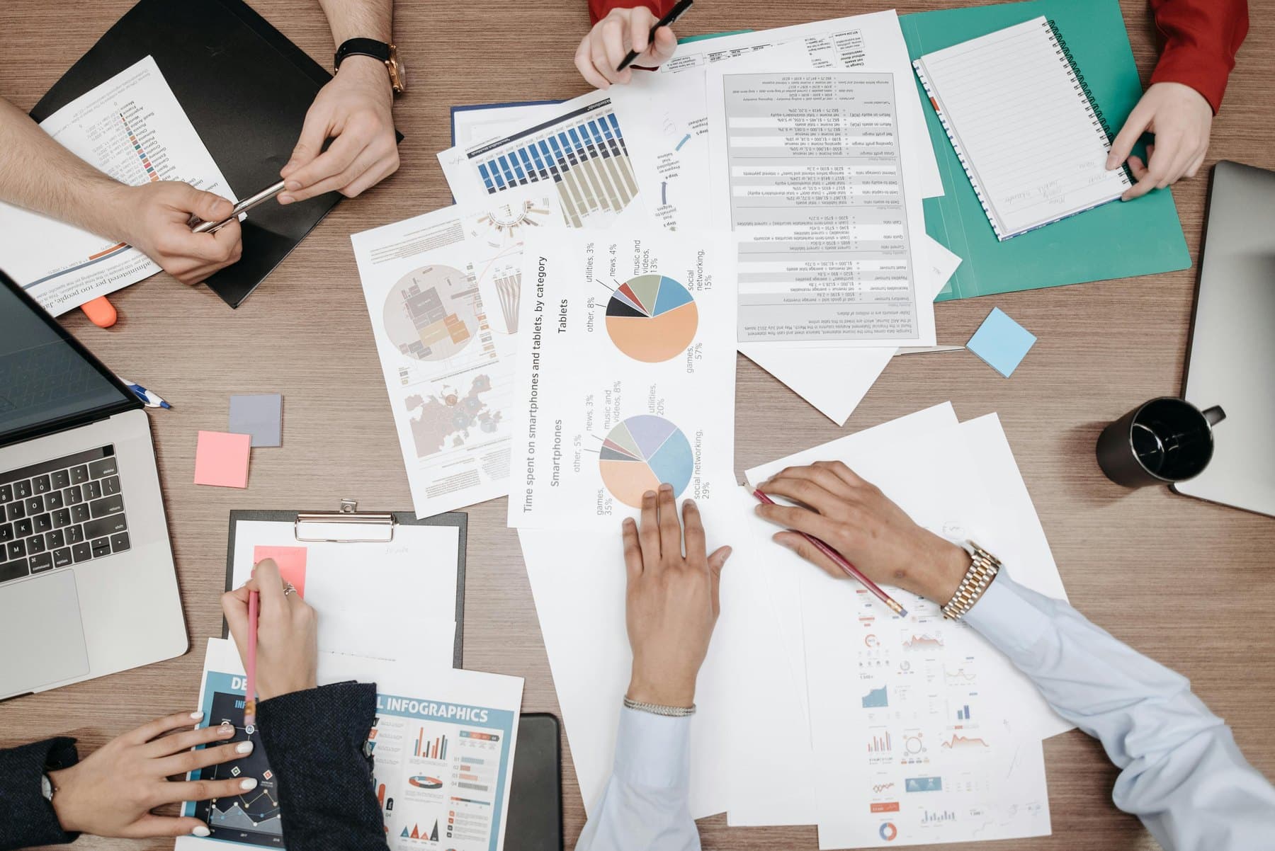 Reporting desk with analytics materials and business data