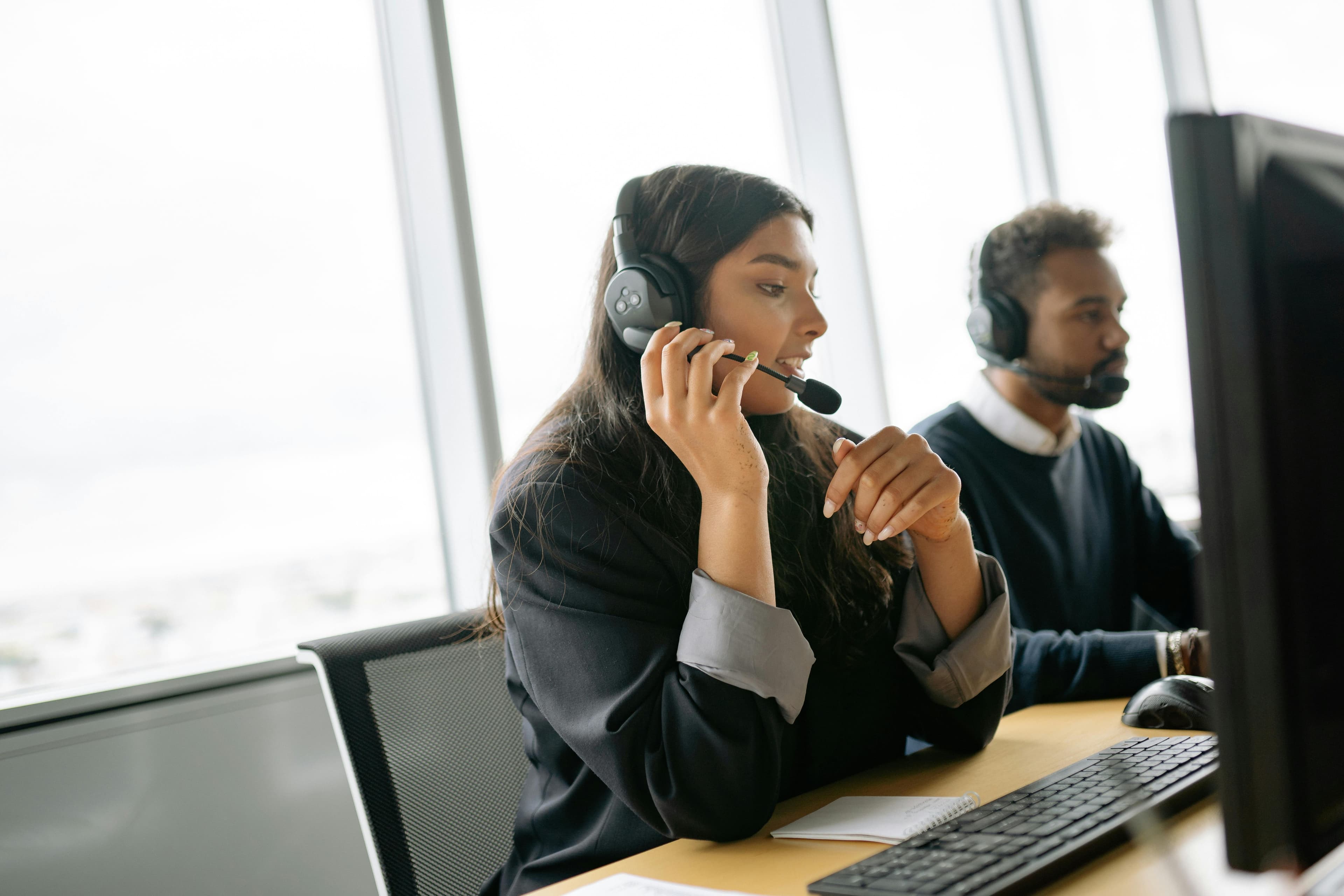 Support team members working in a help desk environment