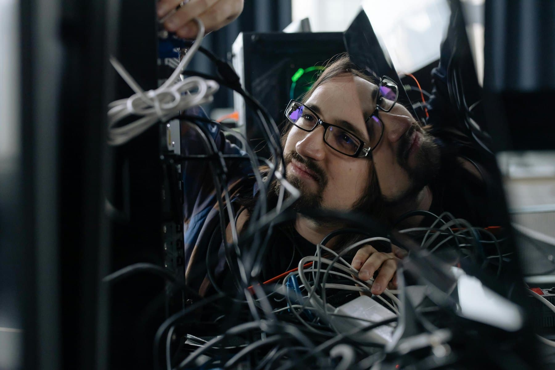 Technician organizing network cables during an installation