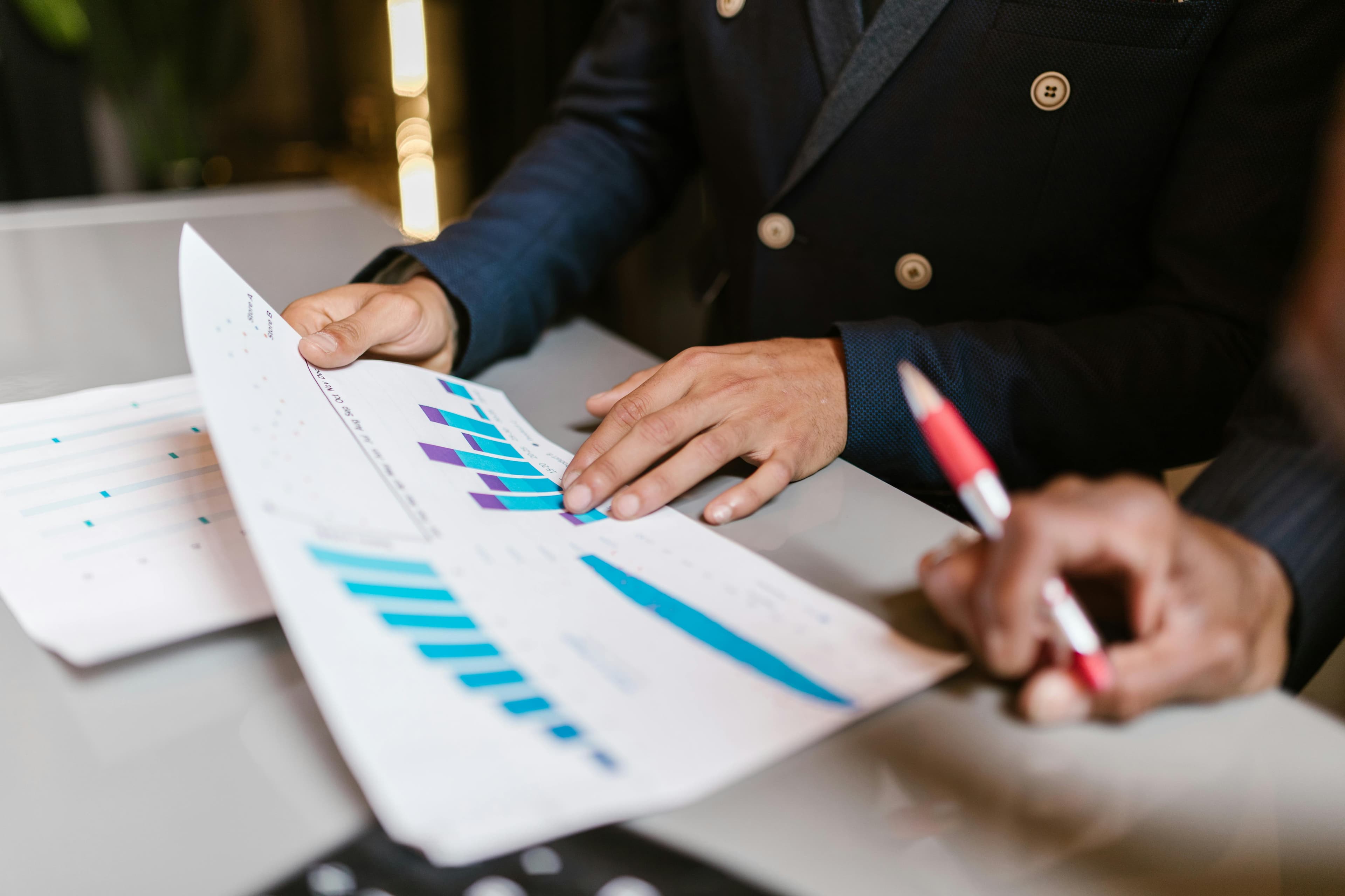 Marketing strategy reports with charts and planning notes