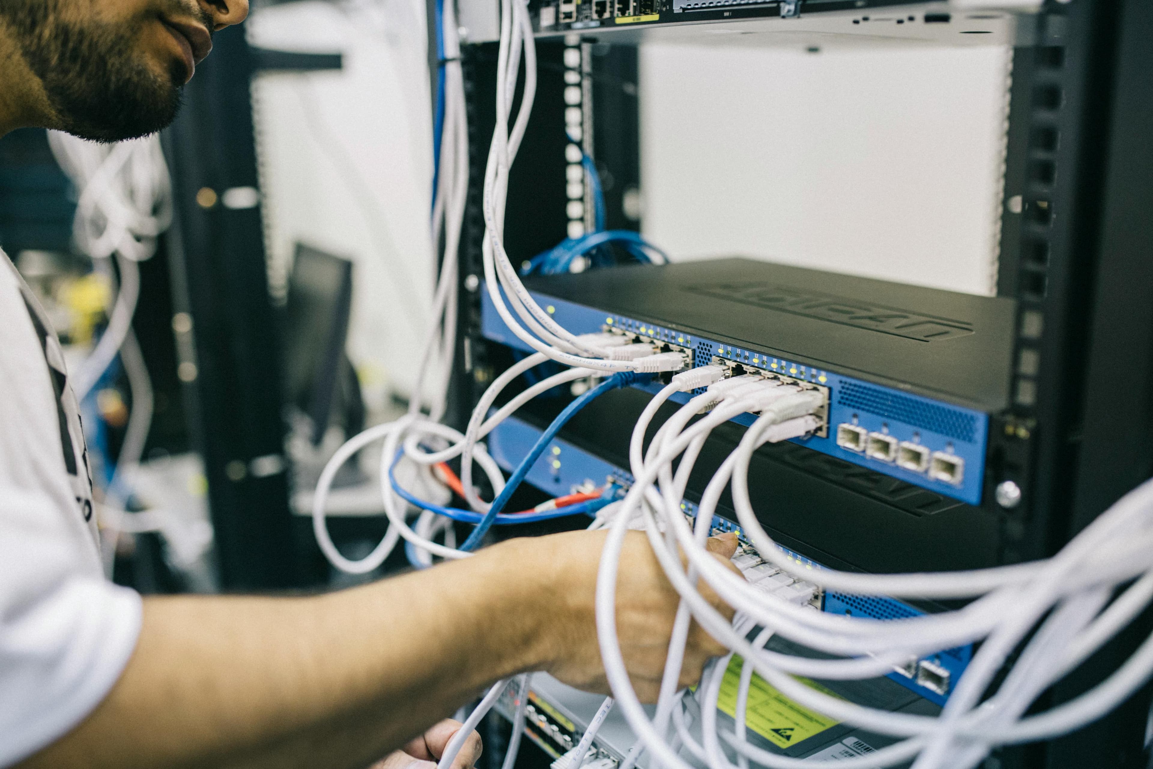 Network technician working with structured cabling