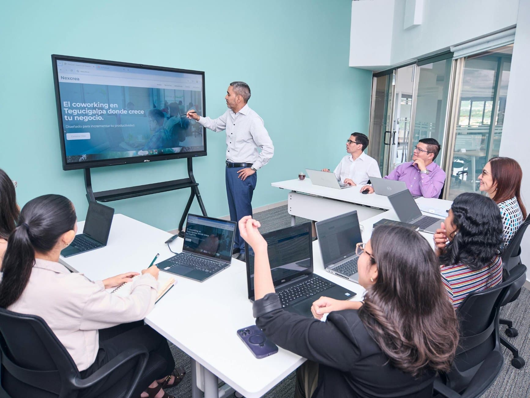 Training and support presentation with laptops in a professional setting